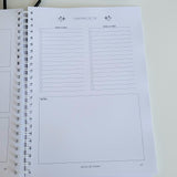 Christmas Notebook with Christmas Decor Planner-Christmas themed cover on a white surface